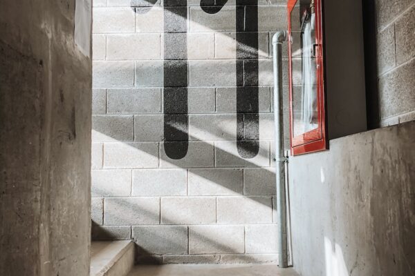 red fire extinguisher mounted on wall